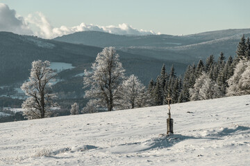 Cross on Zhuri at winter, Sumava national park, Czech republic 