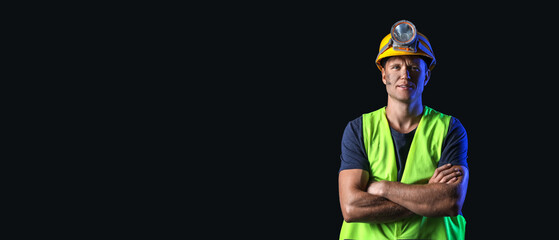 Miner man on black background with space for text