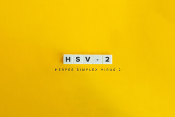 HSV-2 (Herpes simplex virus 2) Banner. Letter Cubes on Yellow Background. Minimal Aesthetics. - obrazy, fototapety, plakaty