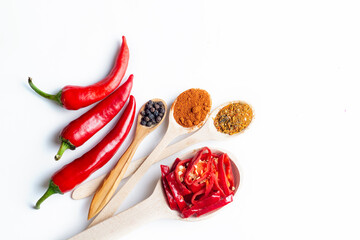 different seasonings for cooking, varieties of hot chilli pepper, ground pepper and spices, oil....