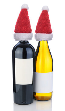 A Cabernet Sauvignon and Chardonnay bottle on white with and Santa Claus Hats.