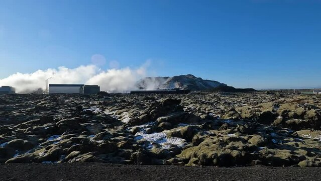 Incredible volcanic landscape with views of a major geothermal power station in the distance.