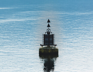 Lonely signal buoy in the ocean.