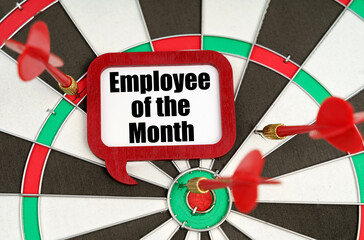 On the darts are darts and a sign with the inscription - Employee of the Month