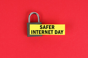 On the red surface there is a lock with a sticker with the inscription - Safer Internet Day