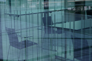 View through glass facade in abandoned conference room