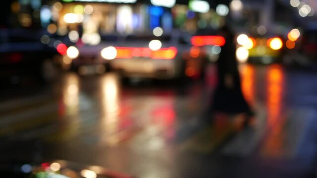 Defocused pedestrians walking on zebra in twilight, people crossing road on crosswalk, crowd on megapolis street in evening dusk. Big city life, urban downtown. Moscow looks like New York. Ped xing.