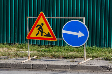 Road signs!Road works with trucks and traffic signs.road works road blocked signs and traffic cones...