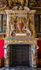 Antique luxury fireplace with gilded lions	