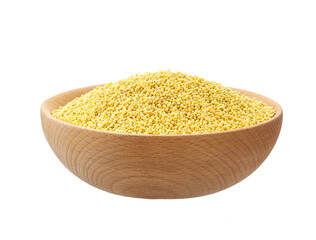 Raw grains of millet in a wooden bowl isolated on white background.