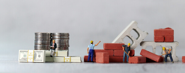 Business concept with money and miniature people. The concept of income disparity.
