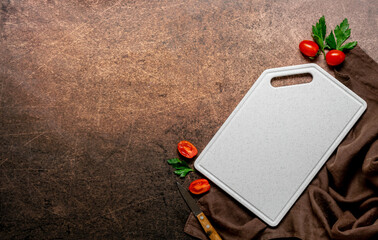 Marble white cutting board ripe spice cherry tomatoes on aged brown background, mockup