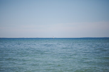 Fototapeta na wymiar Sailboats on Lake Ontario in Canada. Presquile Provincial Park and Conservation Area.