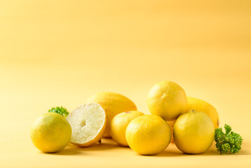 Fresh lemon fruit on yellow, Citrus fruit in summer season