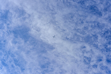 blue sky background with airplane