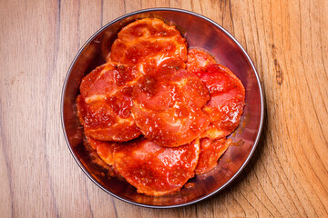 Raw pork on plate, Korean traditional style fresh pork beef belly BBQ, Japanese meat hot pot or Shabu in the restaurant, barbecue food