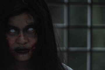 Female zombie in blood devil is scary she haunted at the abandoned building, Horror evil woman...
