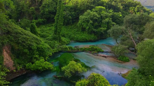 Blue tears in Albania. Beautiful Albanian nature. Benja hot springs. Footage should ideally be used for travel-related videos or nature films.  moving aerial footage