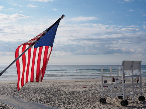 American beach and flag - Powered by Adobe