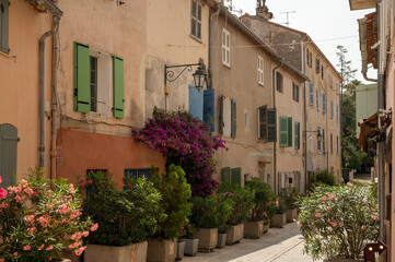 Fototapeta na wymiar Colorful houses in Saint Tropez, village on Mediterranean sea with yacht harbour, Provence, France