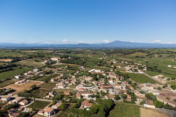 Aerial vIew on medieval buildings and vineyards in sunny day, vacation destination wine making...