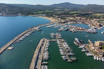 Aerial view on Gulf of Saint-Tropez, sail boats, houses of Port Grimaud and Port Cogolin, summer vacation in Provence, France