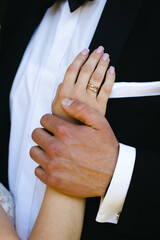 Wedding, tender hands of the bride and groom