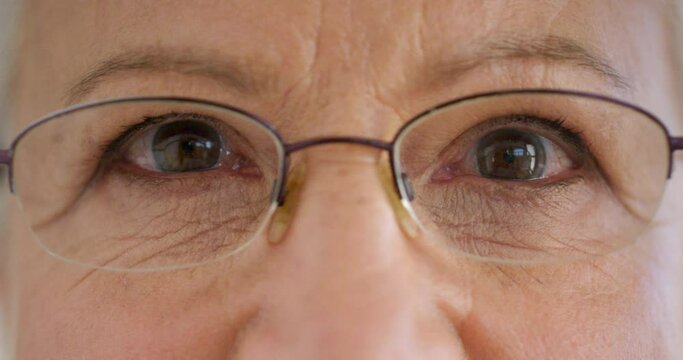 Closeup face of a senior womans eyes with glasses to improve her vision. Portrait of an elderly lady with spectacles to help with eyesight or nearsightedness. Everything deteriorates as we age