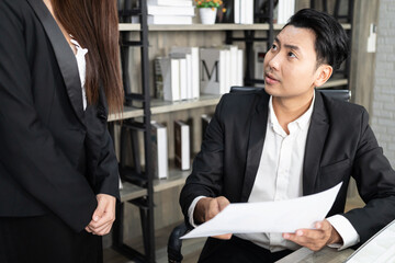A male boss who pursues responsibility and a female businessman who receives power harassment. dissatisfied boss points on rude mistakes on report criticizing work scolding accusing  female employee