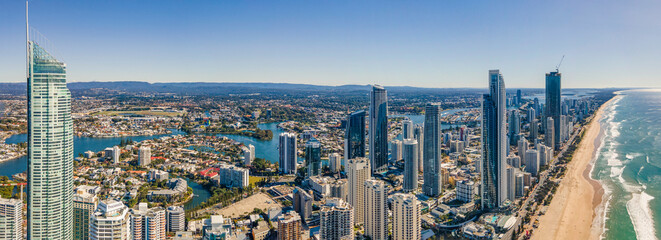 Panoramic aerial drone view of the iconic Gold Coast Beach at Surfers Paradise on the Gold Coast of Queensland, Australia on a sunny day  - obrazy, fototapety, plakaty