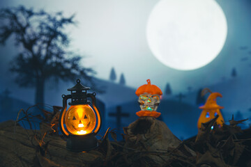 Obraz na płótnie Canvas Spooky cemetery with glow halloween pumpkin