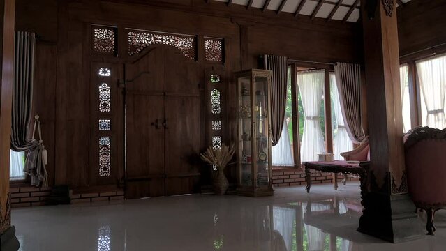 Traditional wooden house interior view or JOGLO house design panning shot