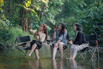 group of Asian girls enjoying a day at the  during holiday camping