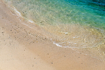 Sand beach and turquoise seawater. Beautiful turquoise clear seawater at beach. Momong Beach, Lampuuk, Aceh.