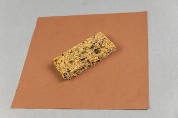 Protein Energy Bar on brown. A gluten-free, sugar-free snack. Oatmeal flapjack with fruit. Healthy Foods.