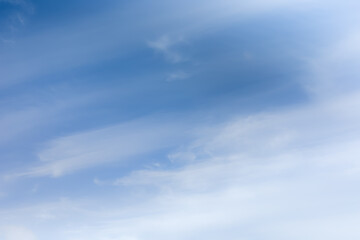 Soft blue sky with light clouds. Calm texture. Nature abstract background. Fresh air, weather and freedom concept