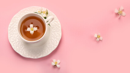 Jasmine tea on color background.