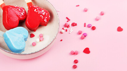 Different type of popsicle ice-cream on pink background.