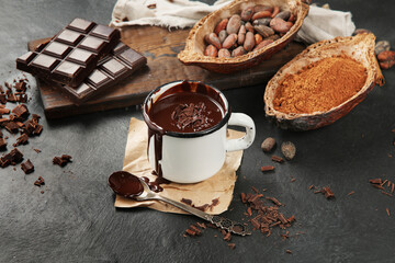 Melted chocolate drink on dark background.