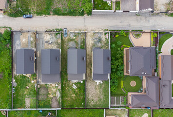 Aerial view of area for pleasant living in suburban district. Houses with beautiful gardens.