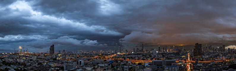 Menacing storm above Bangkok city life background