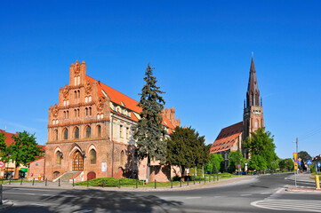 Fototapeta na wymiar Former Town Hall (now the Cultural Center) in Chojna, West Pomeranian voivodeship, Poland. The Town Hall is a Gothic masterpiece, built in the 13th century and rebuilt