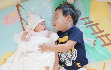 Big Brother Huging his New-born Baby Girl, Sibling relationship