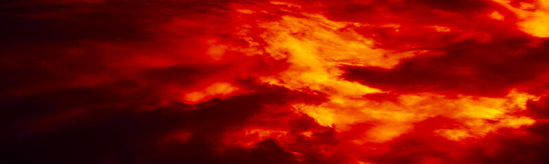 Black red orange sky with clouds. Fire and smoke effect. Night. Dramatic skies background with...