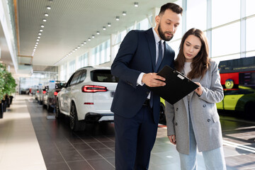 an employee of an insurance company offers to purchase a policy in a car dealership