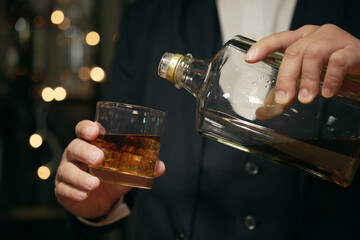 Businessmen in suits drinking whiskey