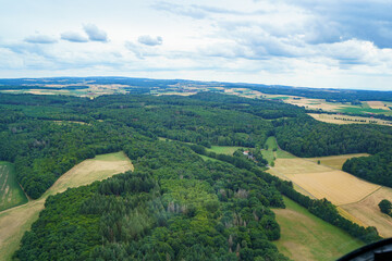 Fototapeta na wymiar Landscape in Germany in summer from above. Top view. Nature, forests, fields.