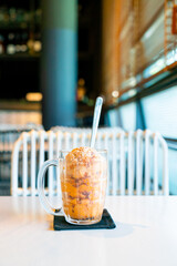 Thai tea ice scoop in glass