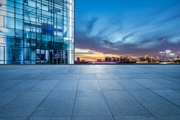 Empty floor and modern city skyline with building scenery at sunset in Suzhou, China. high angle...