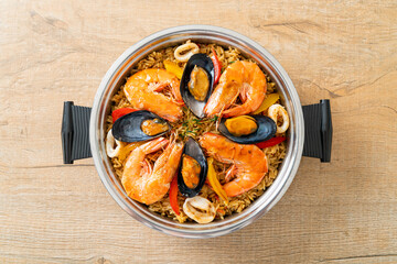 Seafood Paella with prawns, clams, mussels on saffron rice